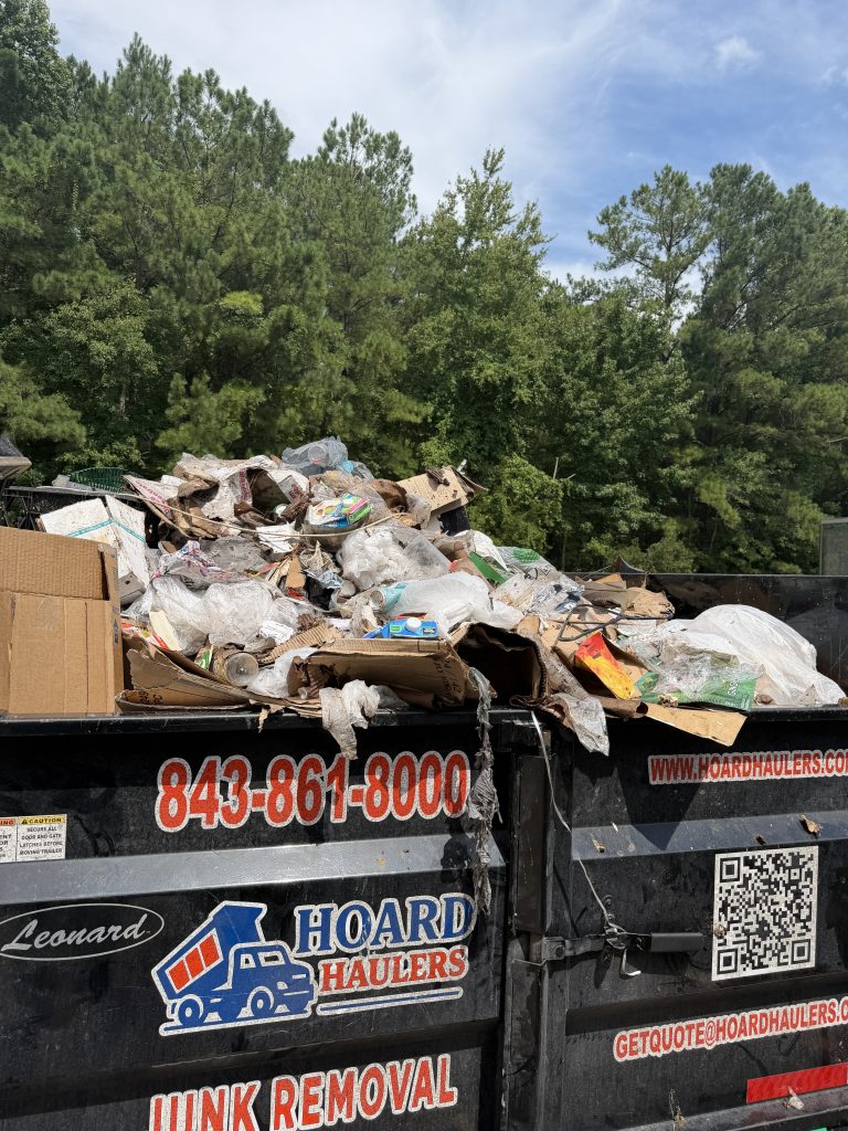 Hoard Haulers branded trailer loaded after a pickup in North Myrtle Beach